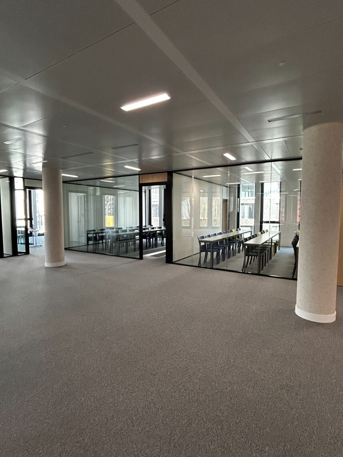 Open learning area with glass classrooms
