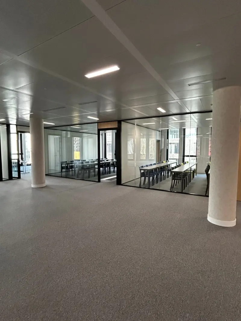 Open learning area with glass classrooms